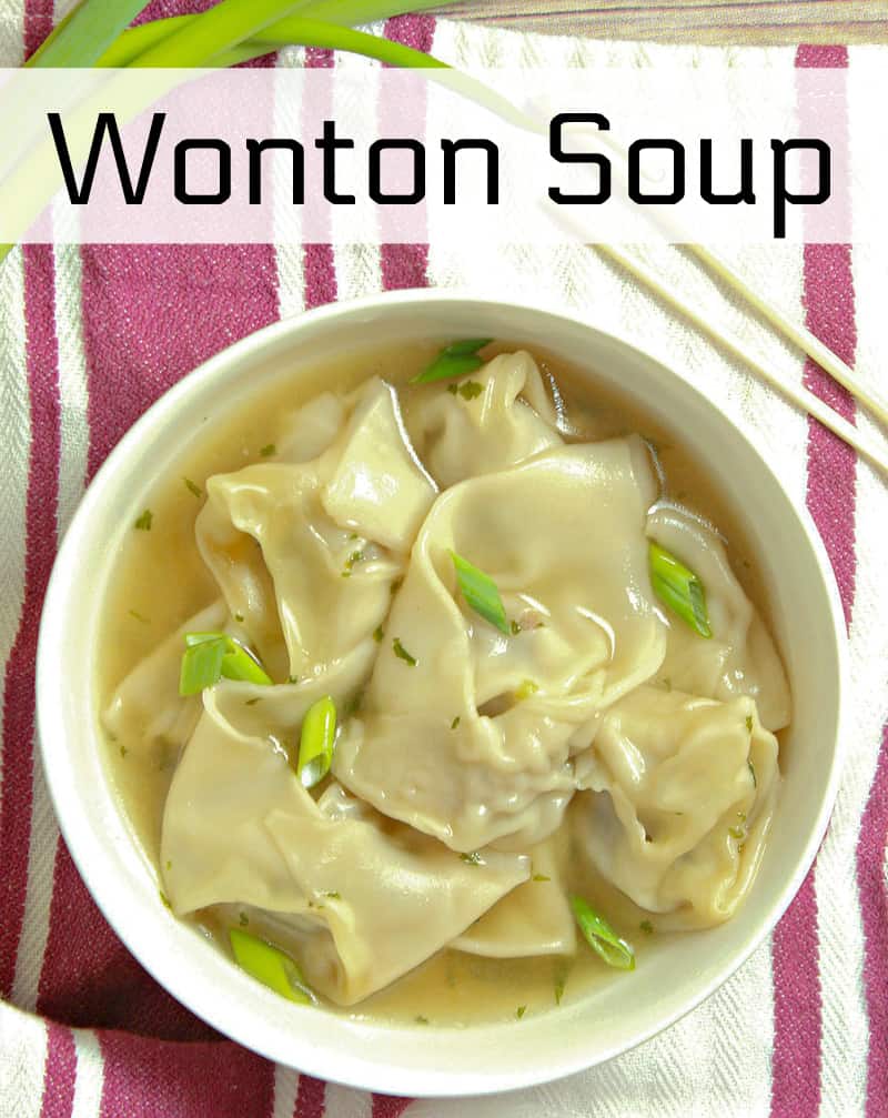 A bowl of food on a plate, with Soup and Wonton