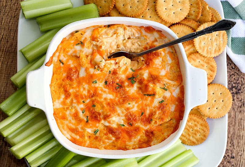 A plate of food with a fork, with Buffalo chicken dip