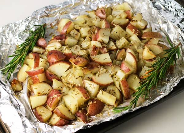 A dish is filled with food, with Red potatoes