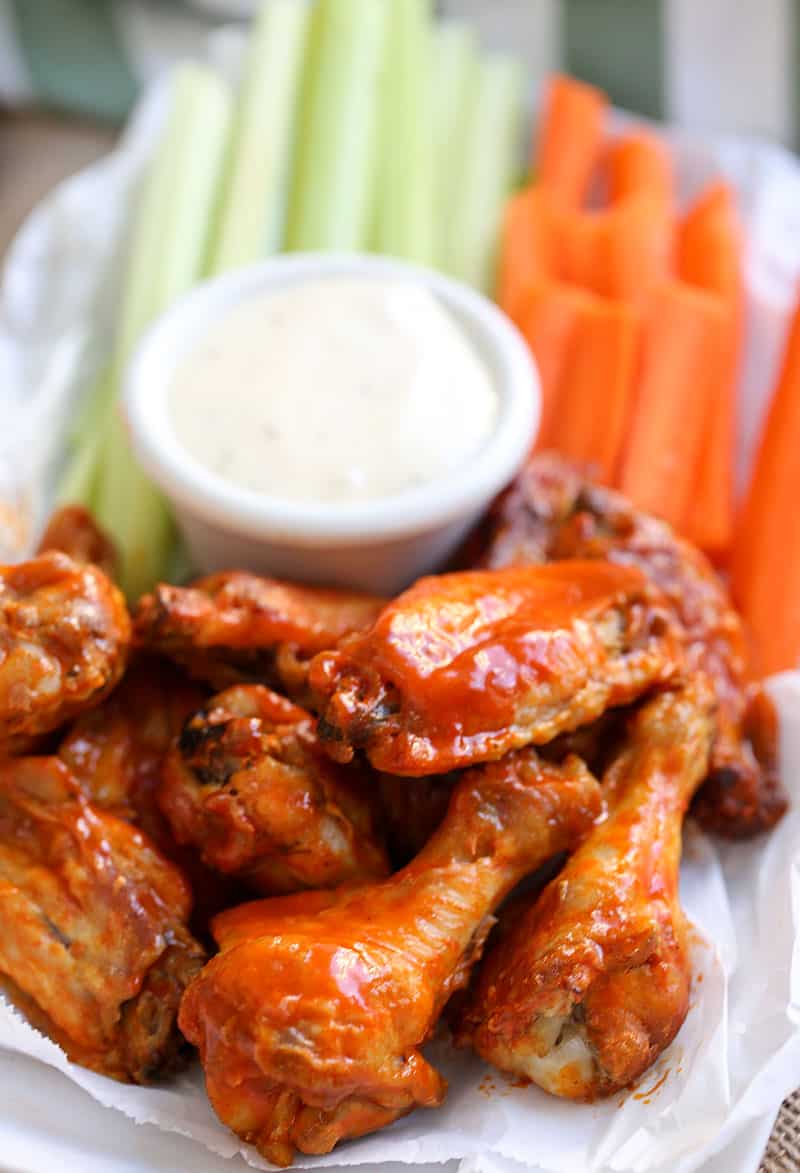 A dish is filled with food, with Buffalo chicken wings