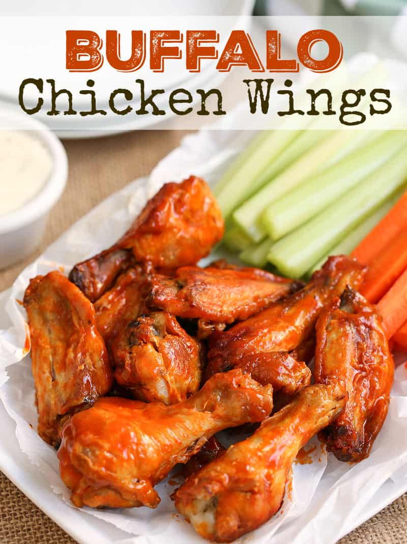 A dish filled with meat and vegetables on a plate, with Buffalo chicken wings