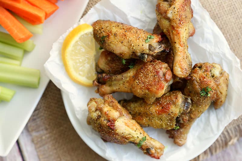 A plate of food with lemon pepper wings