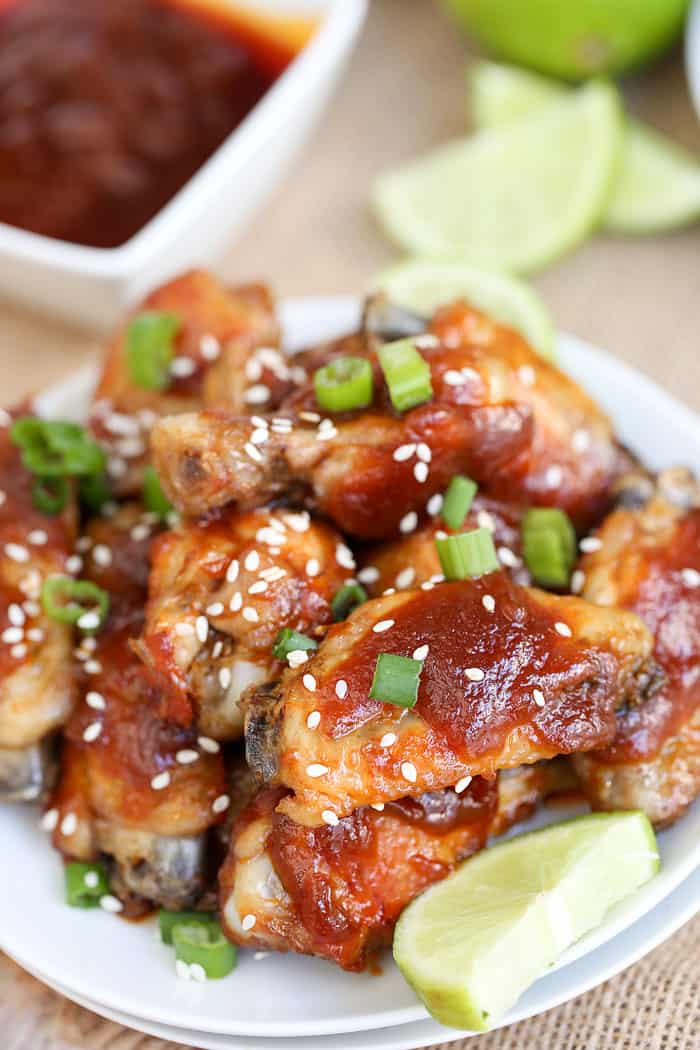 A close up of a plate of food, with Sriracha Chicken Wings