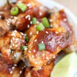 A close up of a plate of food, with Sriracha Chicken Wings