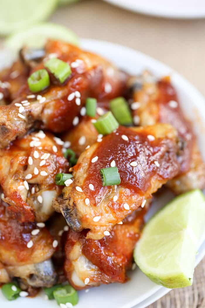 A close up of a plate of food, with Sriracha Chicken Wings