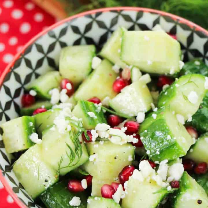 A bowl of salad, with Cucumber and Pomegranate