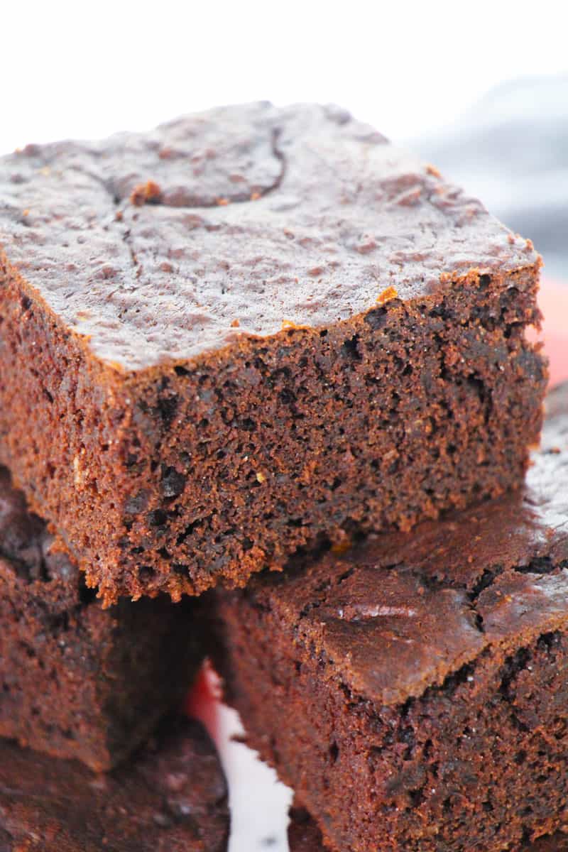 A close up of a piece of chocolate zucchini brownies 