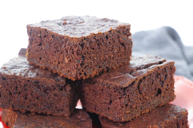 A close up of a piece chocolate zucchini brownies 