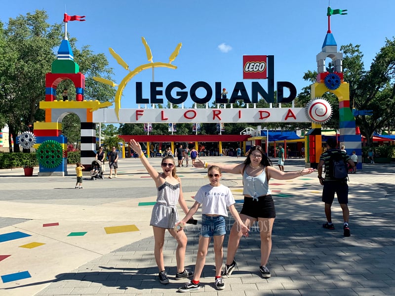 kids in front of legoland sign