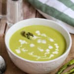 A bowl of food on a table, with Soup
