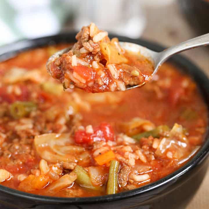 cabbage roll soup in a a bowl and on a spoon