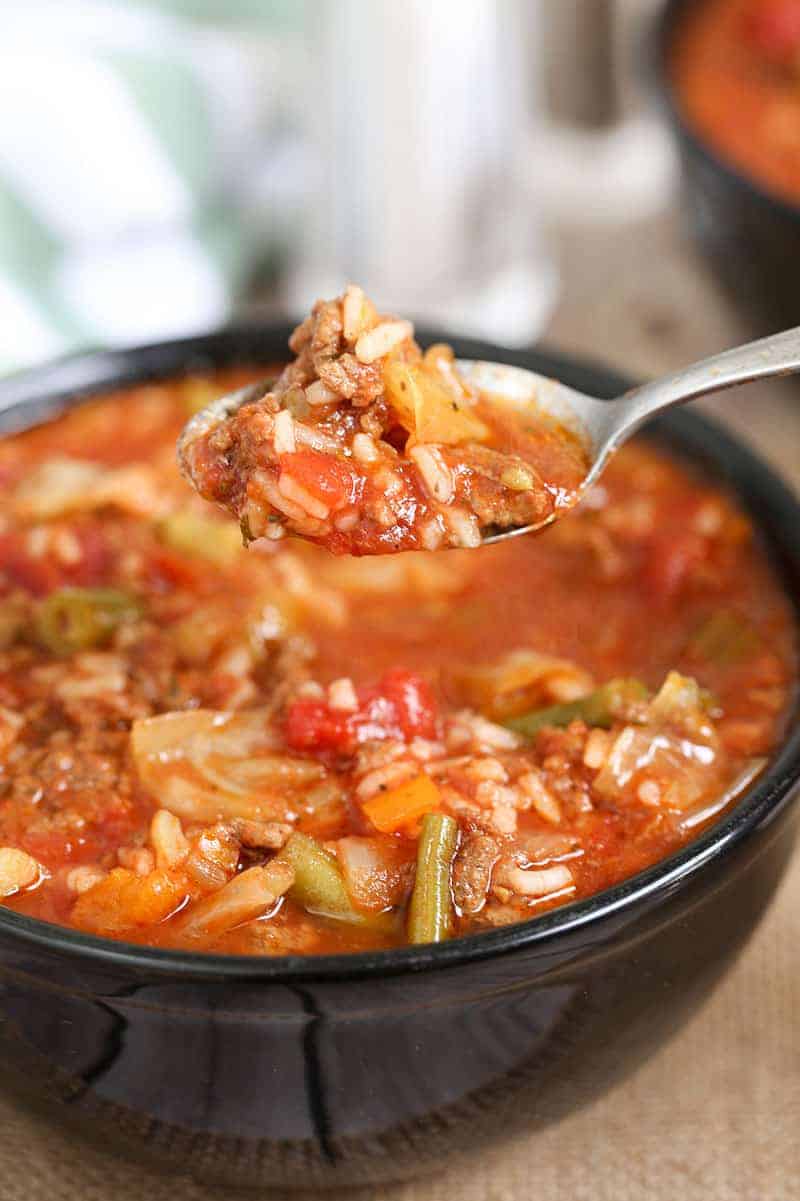 cabbage roll soup in a a bowl and on a spoon