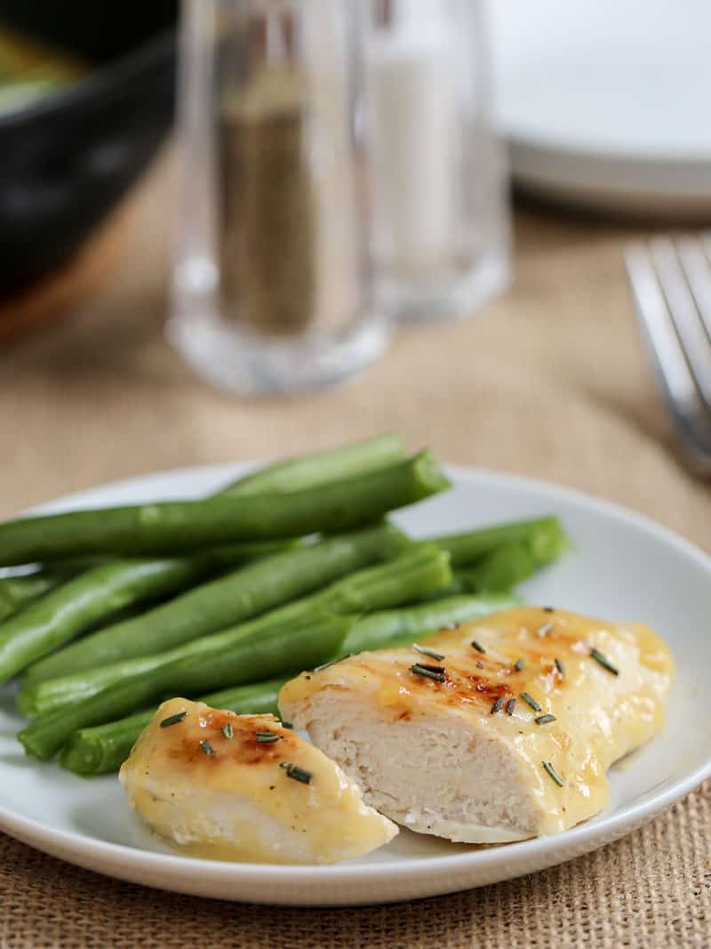 chicken dinner on a plate with vegetables