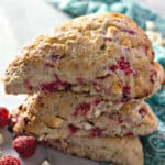 A close up of a piece of scones on a plate, with Chocolate and Raspberry