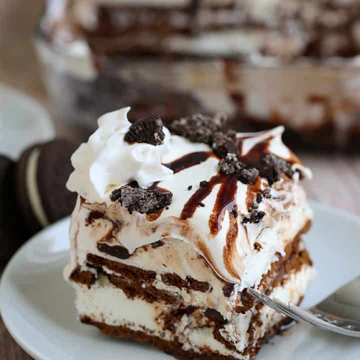 ice cream sandwich cake on a white plate with a fork on the side