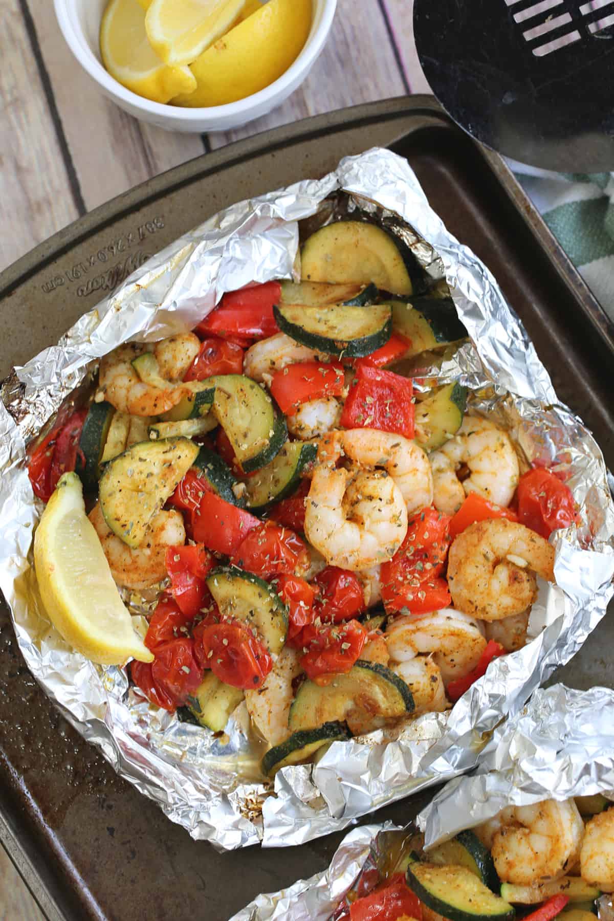 shrimp and vegetables on foil on the table