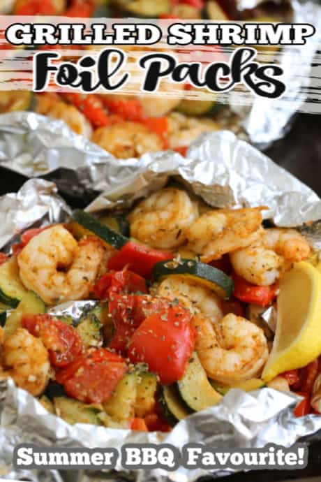 shrimp and fresh vegetables in foil packs with spices and fresh lemon wedge.