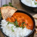 A plate of food with rice and meat, with Chicken and Slow Cooker
