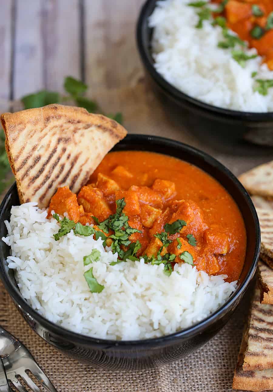 A plate of food with rice and meat, with Chicken and Slow Cooker