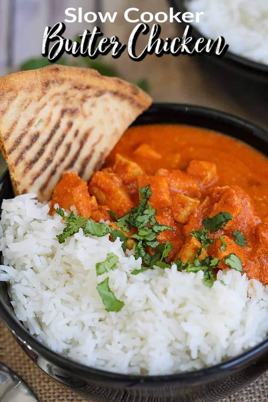 A plate of food with rice meat and bread, with Butter Chicken