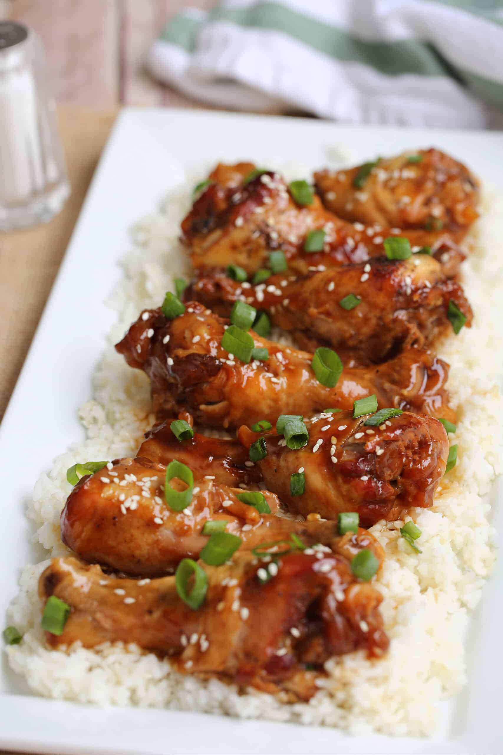 chicken legs and rice on a plate