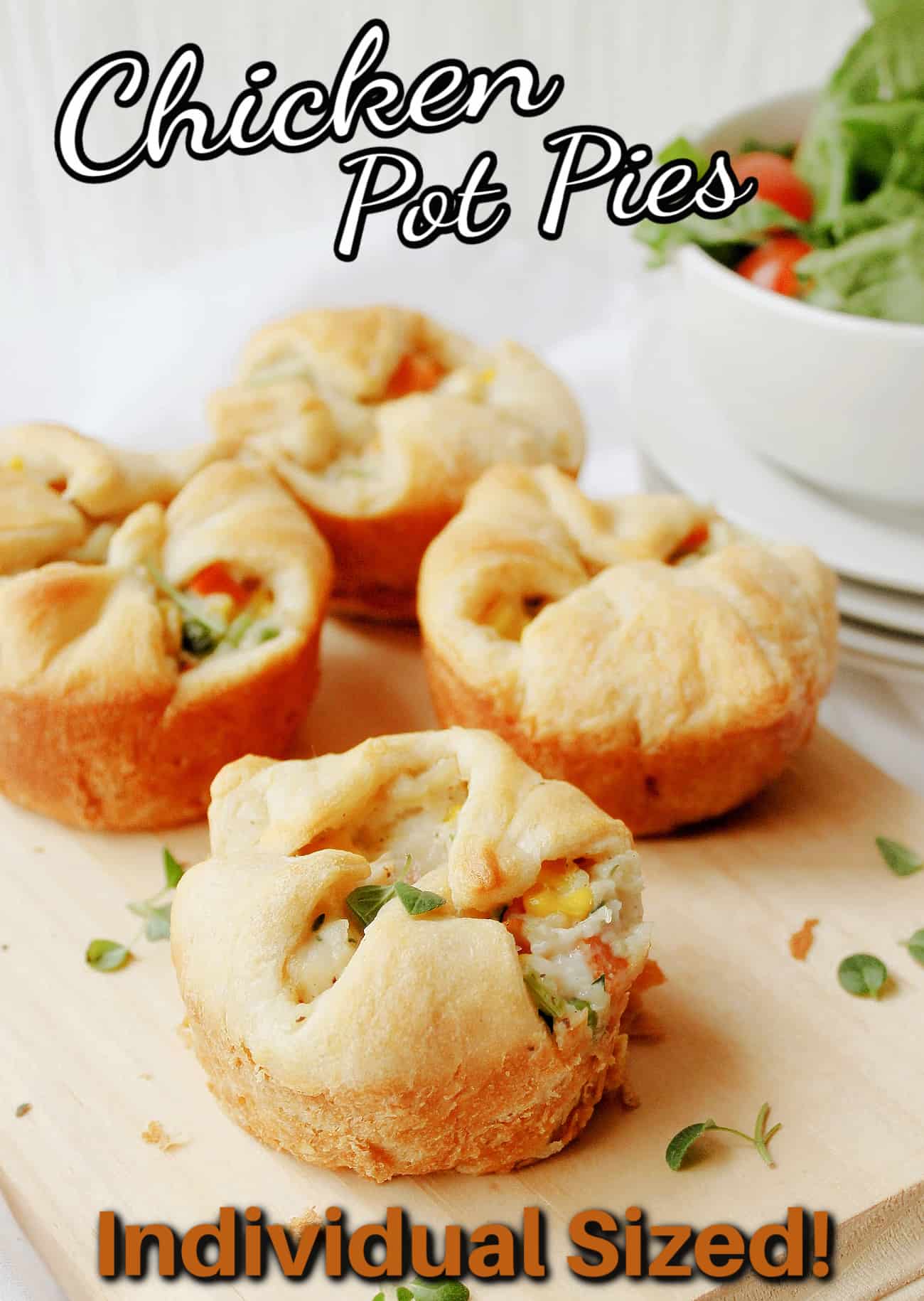 mini chicken pot pies on a cutting board with text
