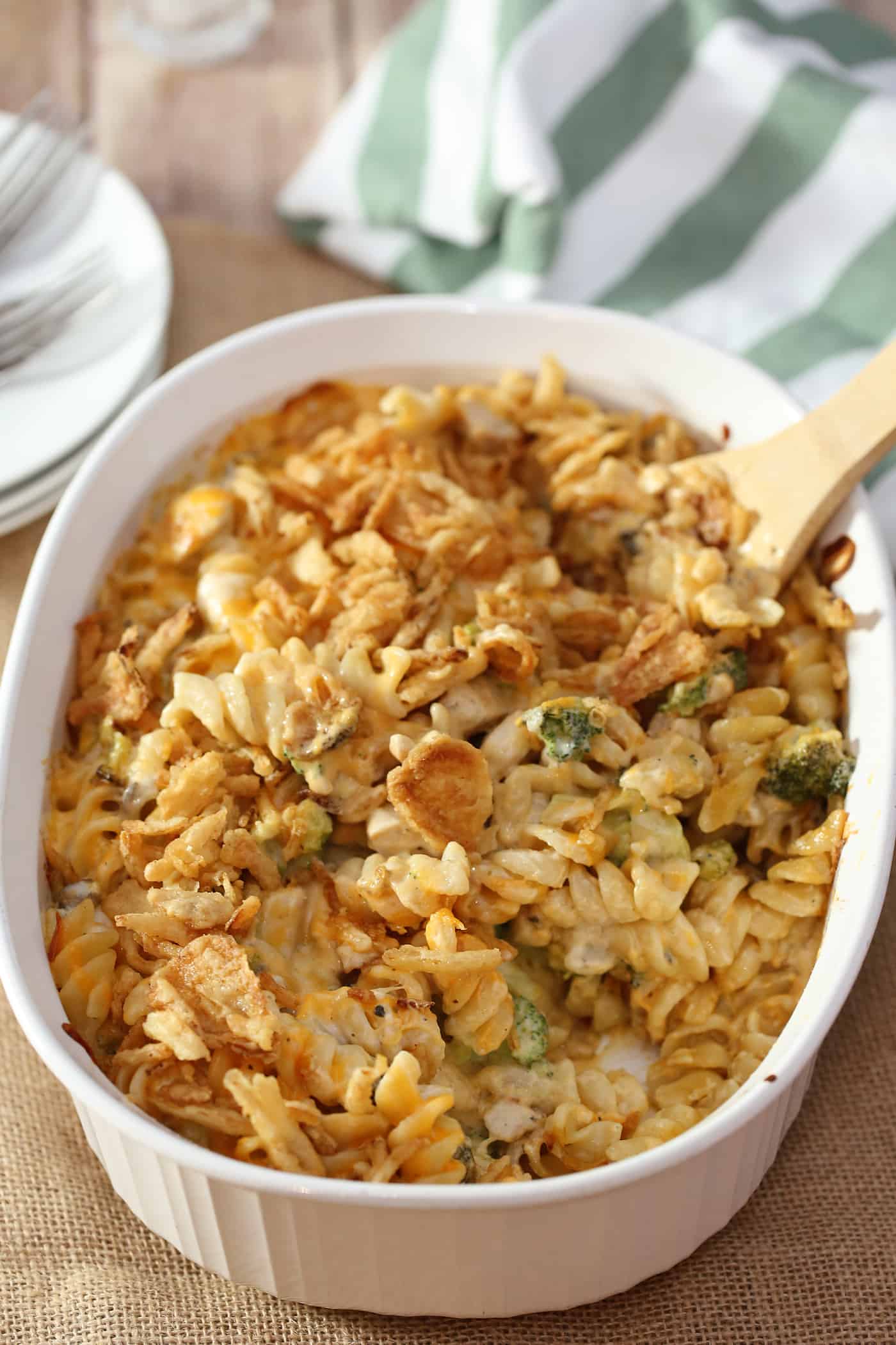 chicken noodle casserole in a dish with wooden spoon
