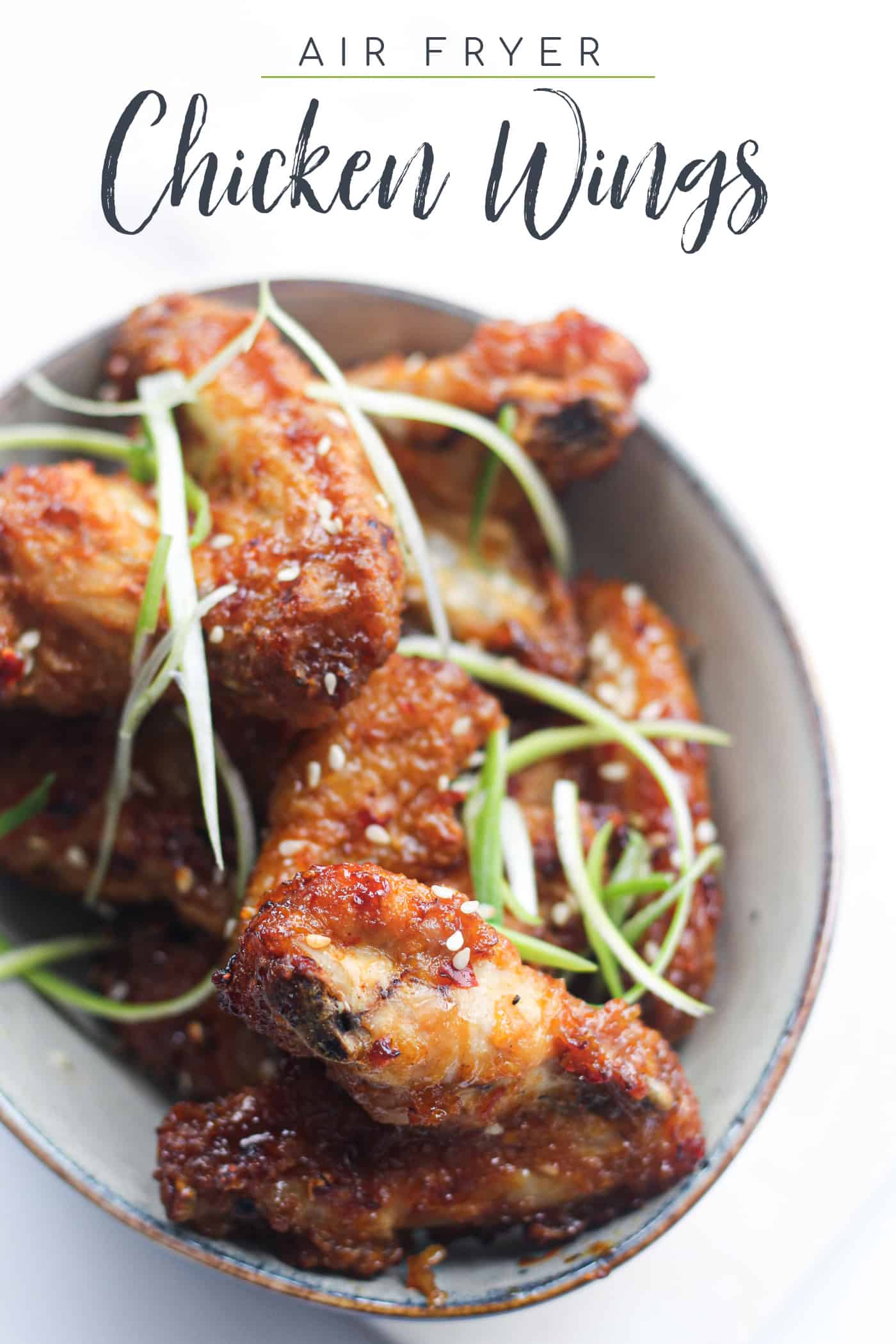 air fryer chicken wings in a bowl with text