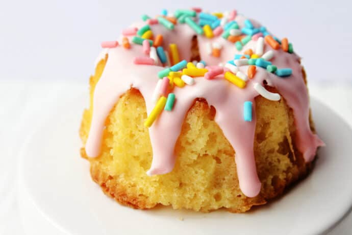 mini bundt cake decorated for easter on a cake stand