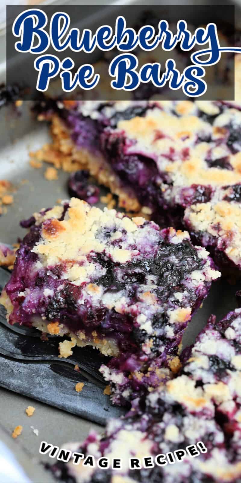a slice of blueberry pie squares being lifted from a baking pan with text
