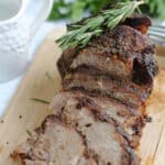 pork roast sliced onto a cutting board
