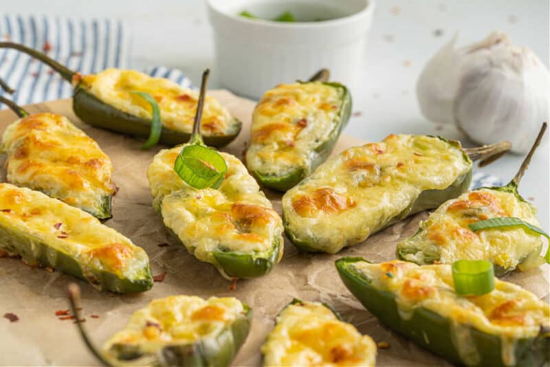 Food on a table, with Cheese and Baked jalapeno poppers