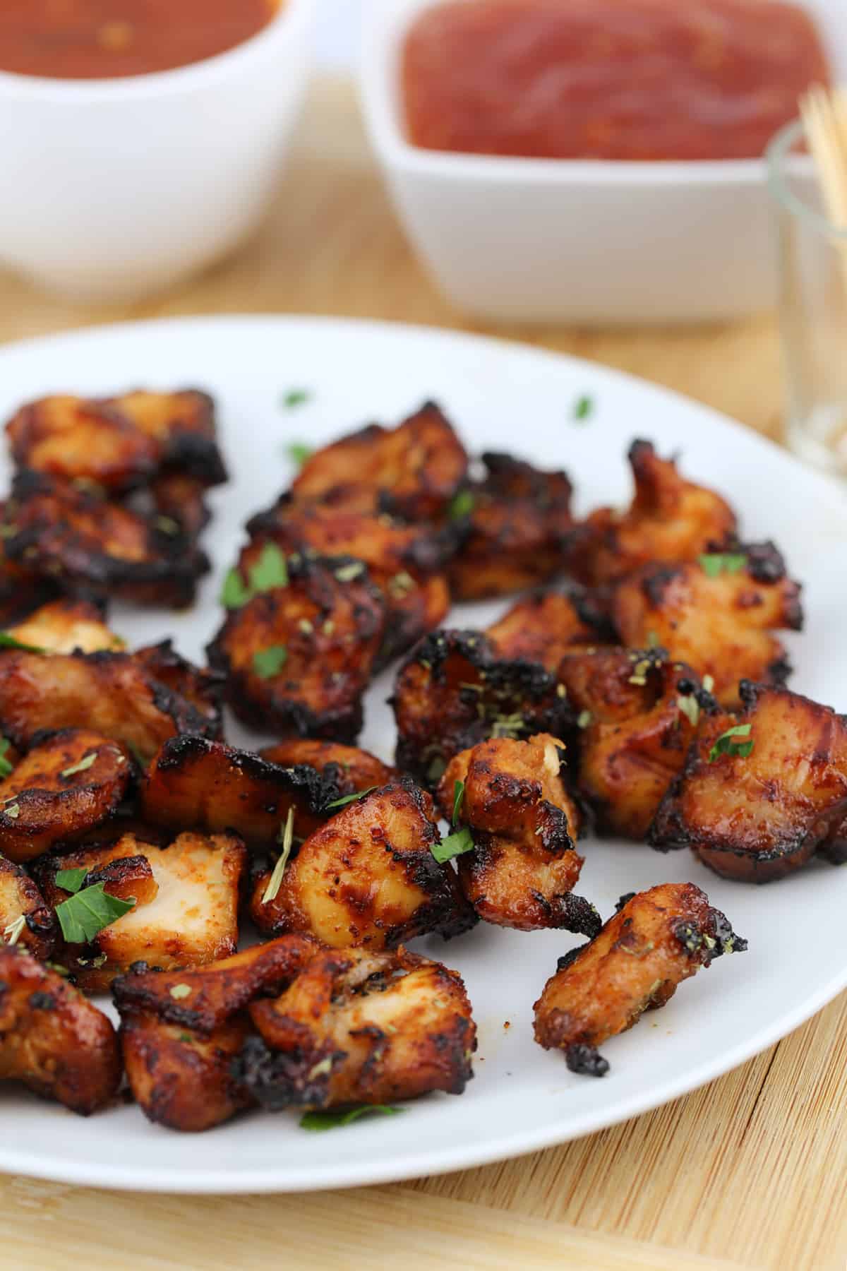 chunks of cooked chicken on a white plate