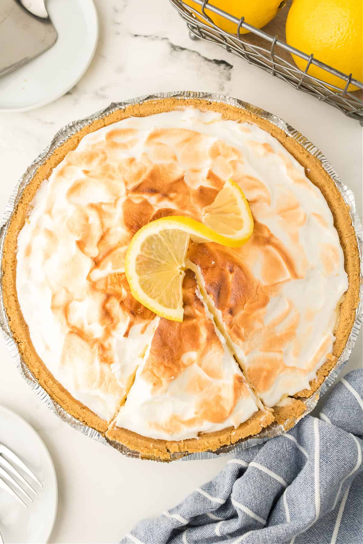 A plate of food on a table, with Lemon and Pie