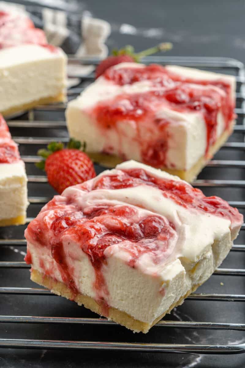 A close up of a strawberry Cheesecake bar