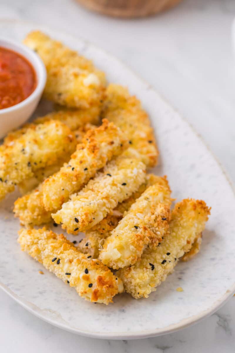 food on a plate, with mozzarella sticks