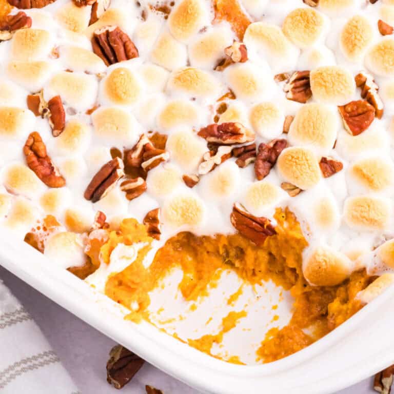 Indulge in the perfect holiday side dish with our irresistible Sweet Potato Casserole recipe, complete with a golden brown marshmallow and pecan topping. This comforting side dish that is both savory and sweet is a classic favorite for the holiday season and any family gathering. 