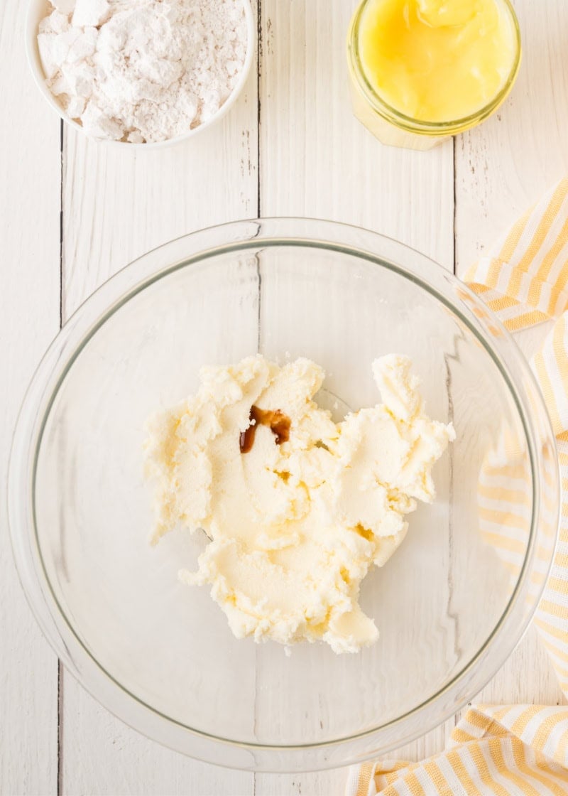 a glass bowl with combined sugar and butter.