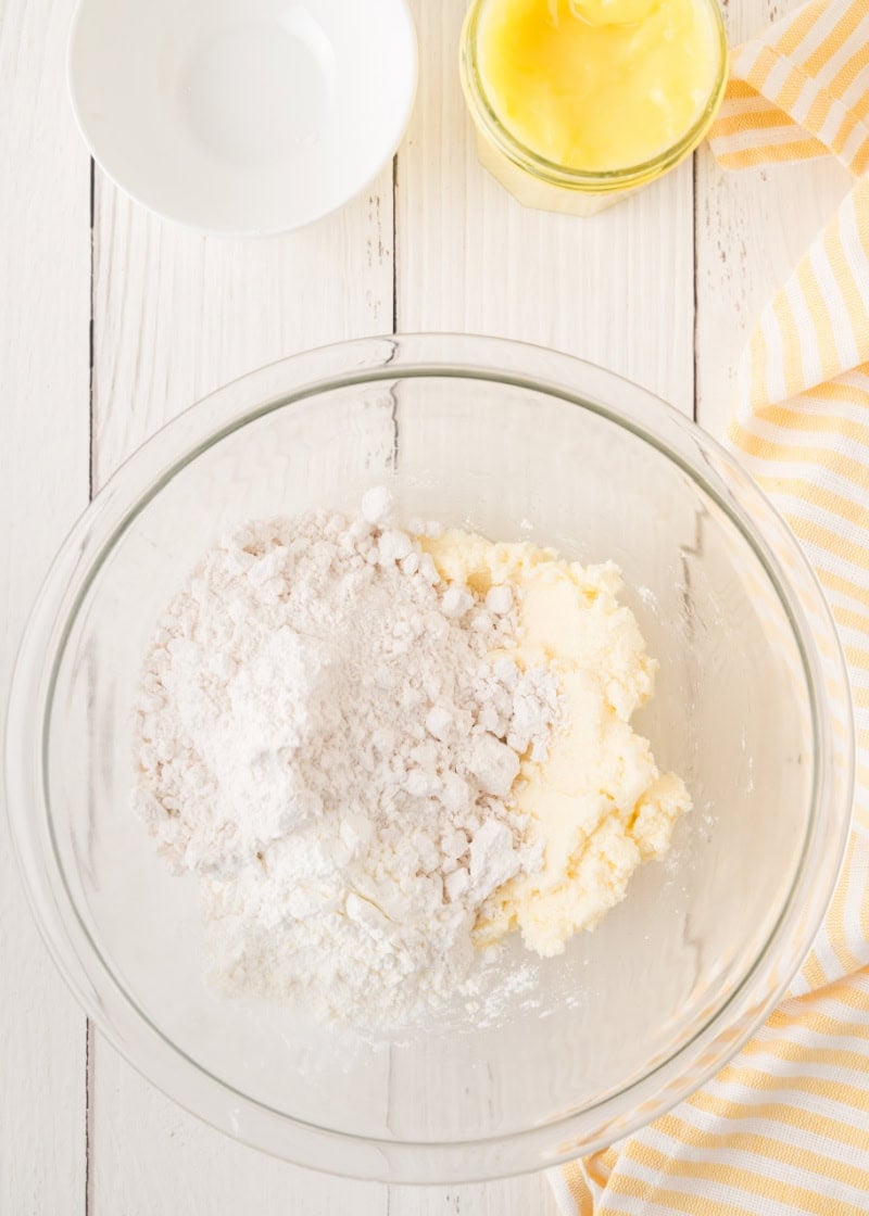a glass bowl with unmixed cookie batter inside.