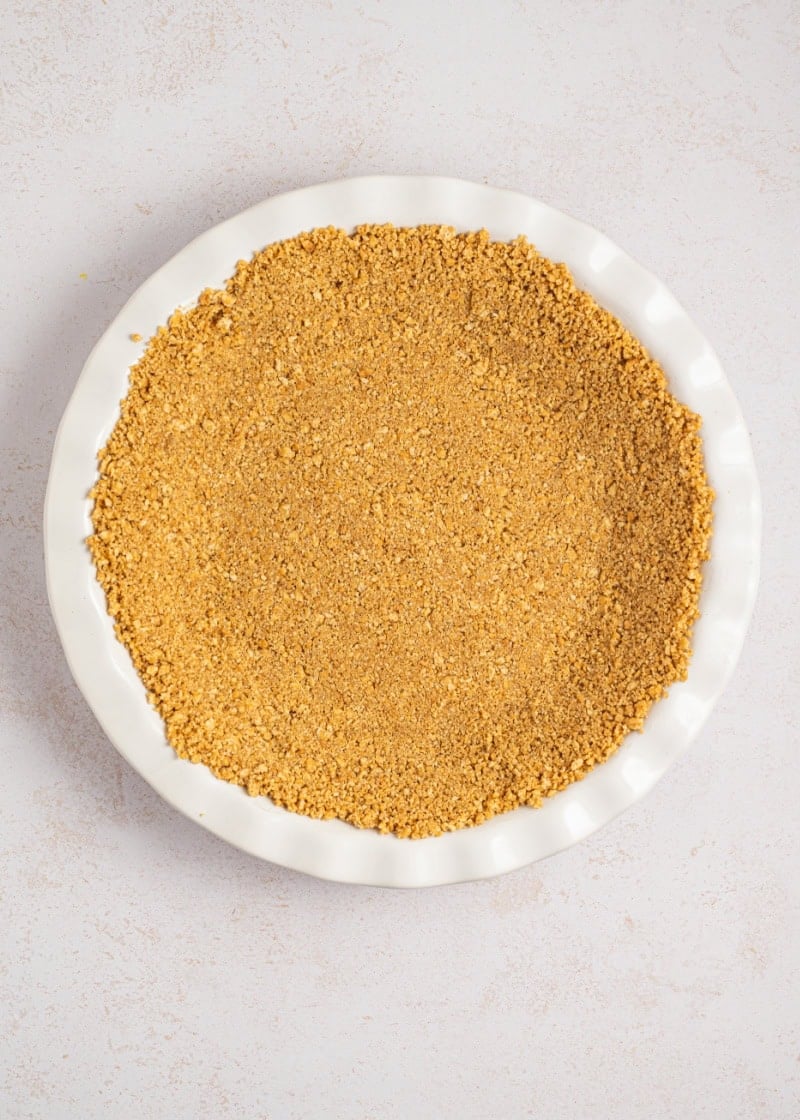 a graham cracker crust in a pie plate.