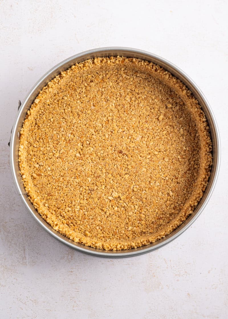 graham cracker crust inside a spring form pan.