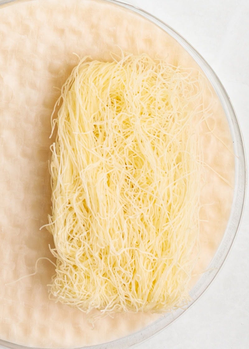 Vermicelli noodles on a piece of rice paper.