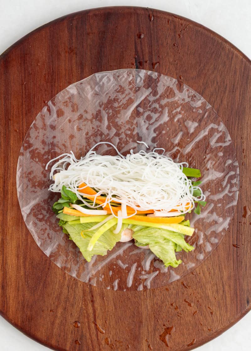 Fresh veggies on a rice paper ready to be rolled up.