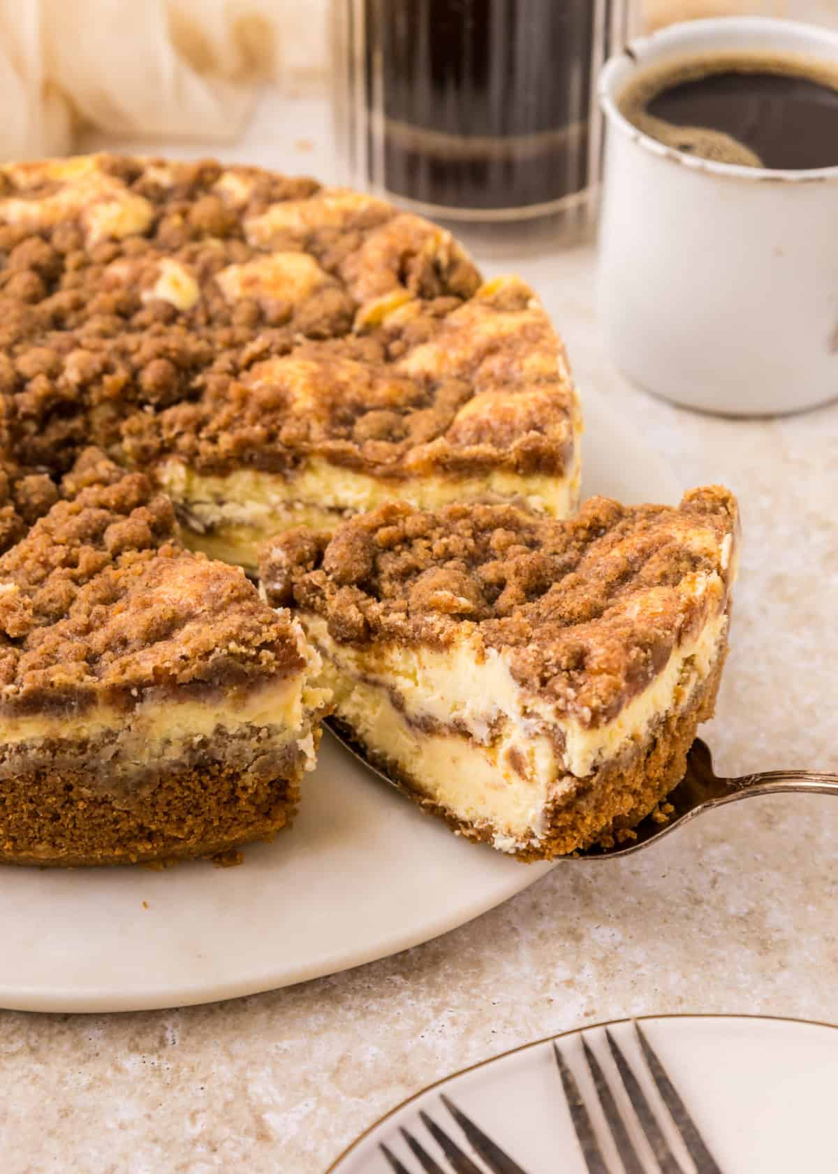 a piece of Coffee Cake Cheesecake being sliced.