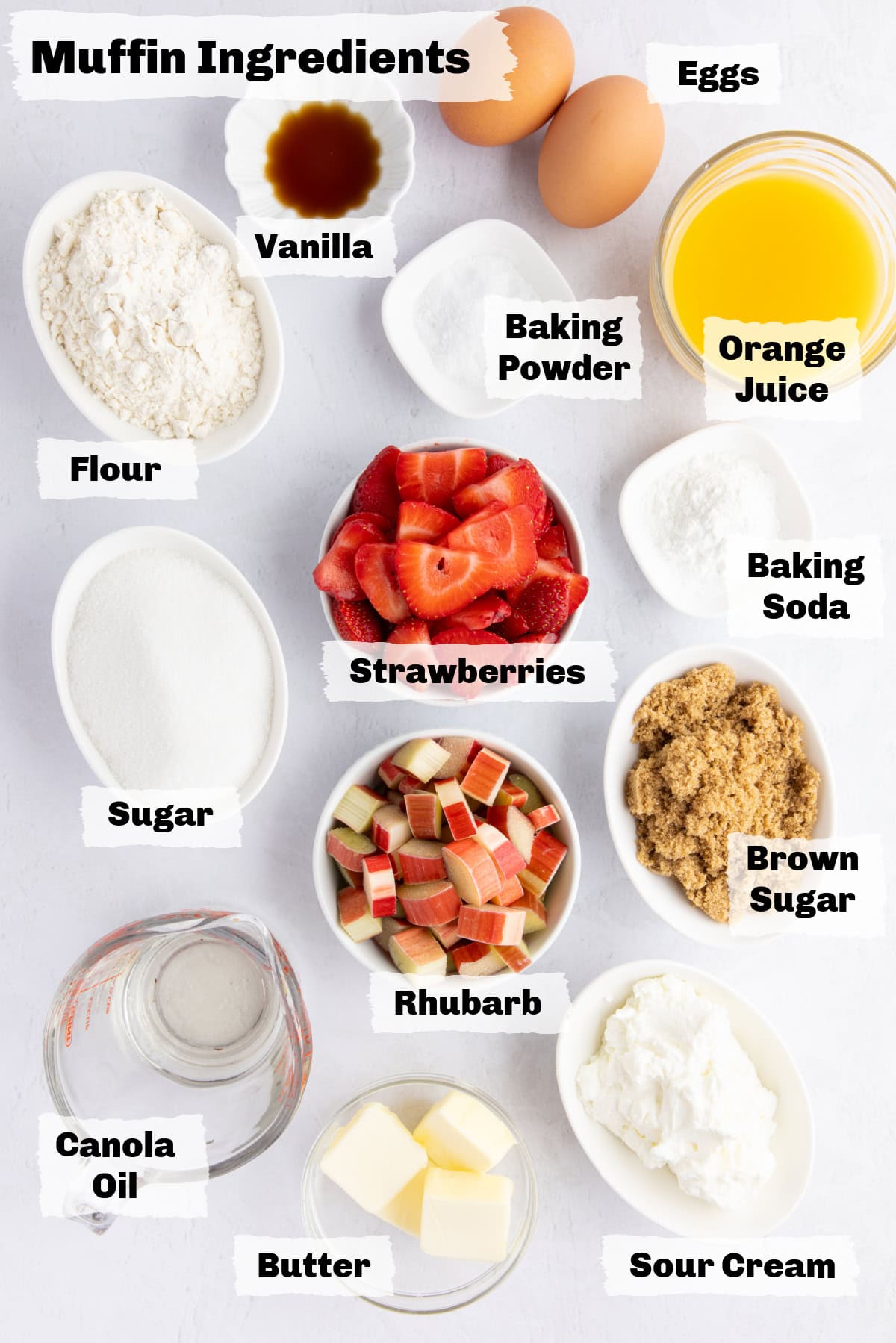 ingredients on a table to make strawberry rhubarb muffins.