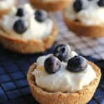 Blueberry cream cheese tarts on a cooling rack.