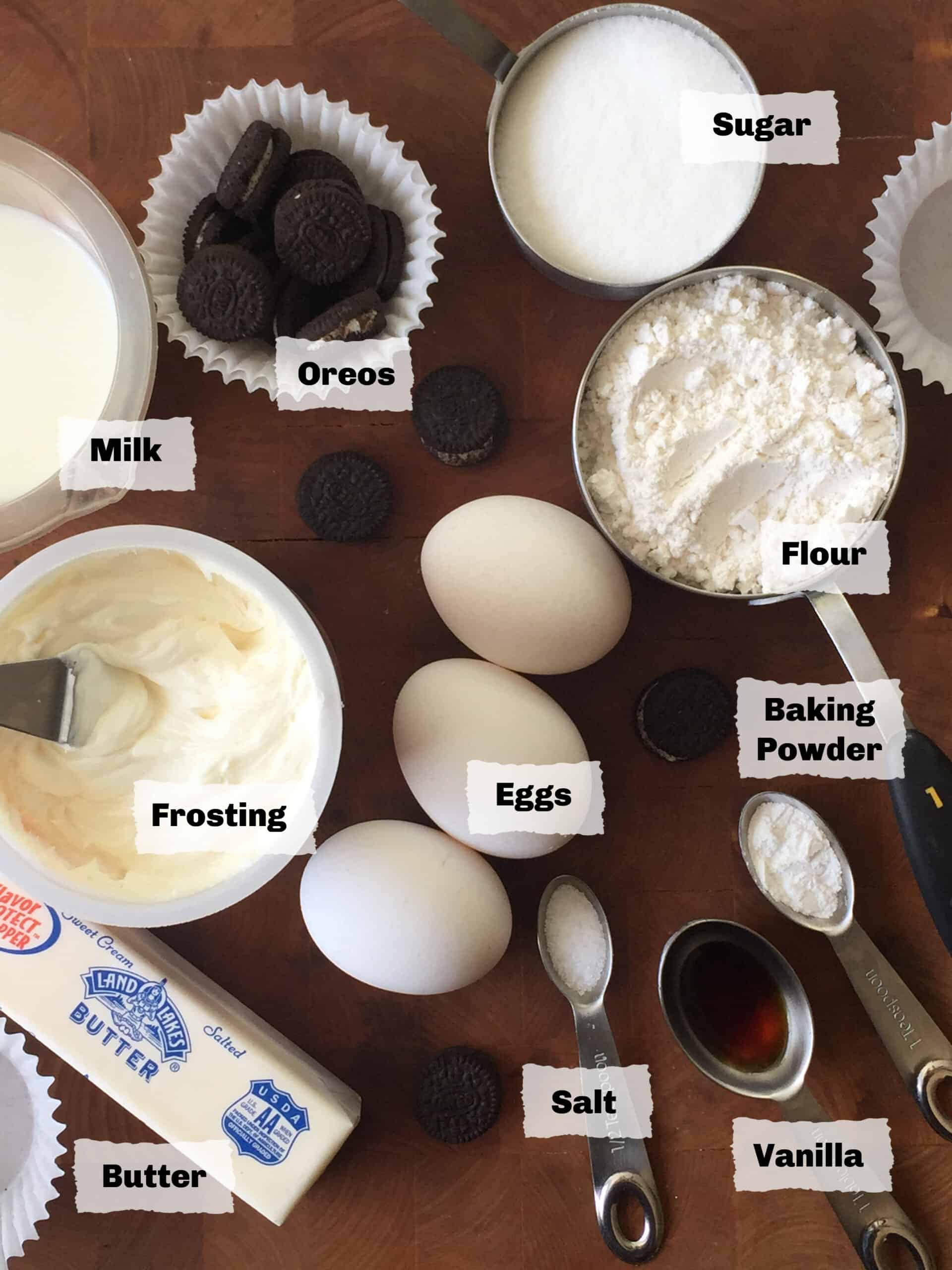 Ingredients on a table to make Oreos Cookies and Cream Cupcakes.