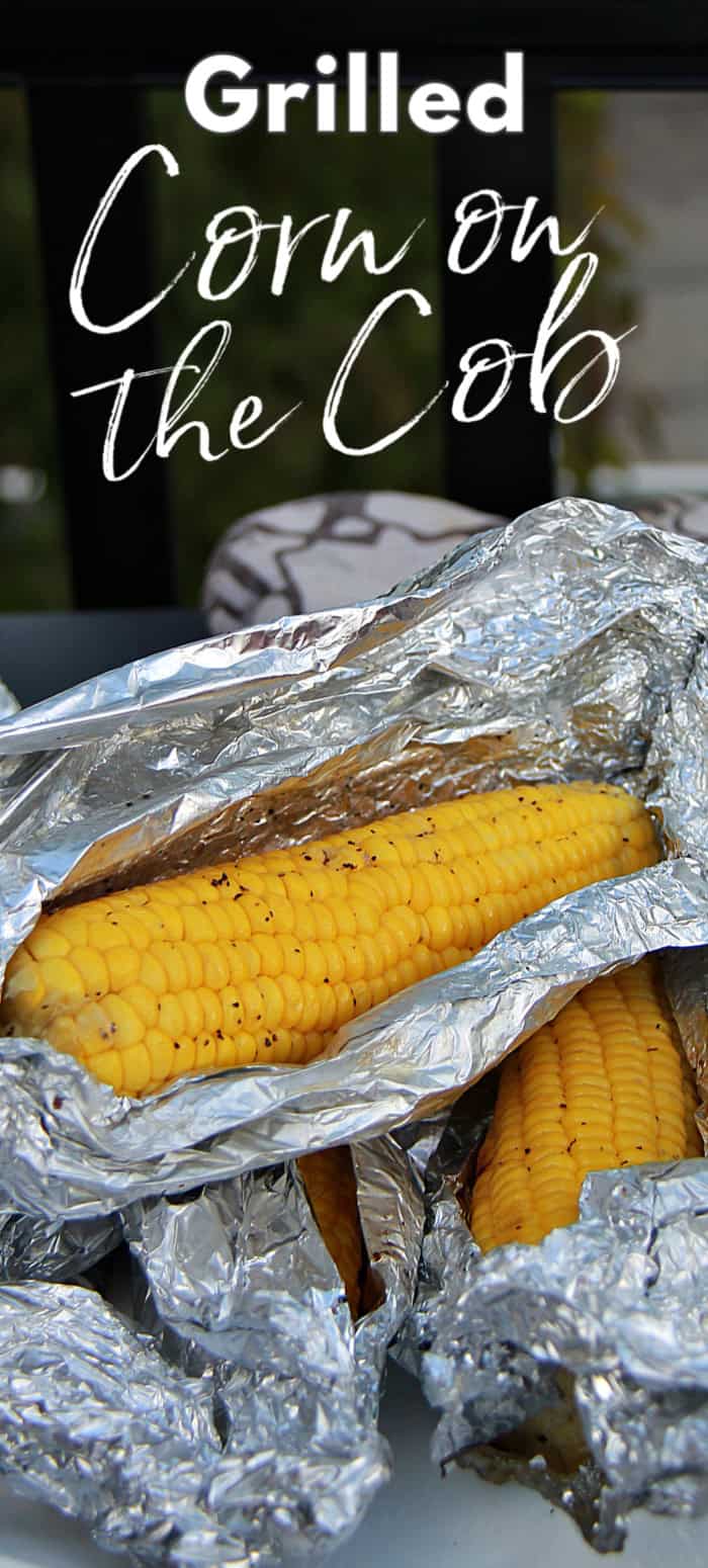 Corn on the cob wrapped in foil.