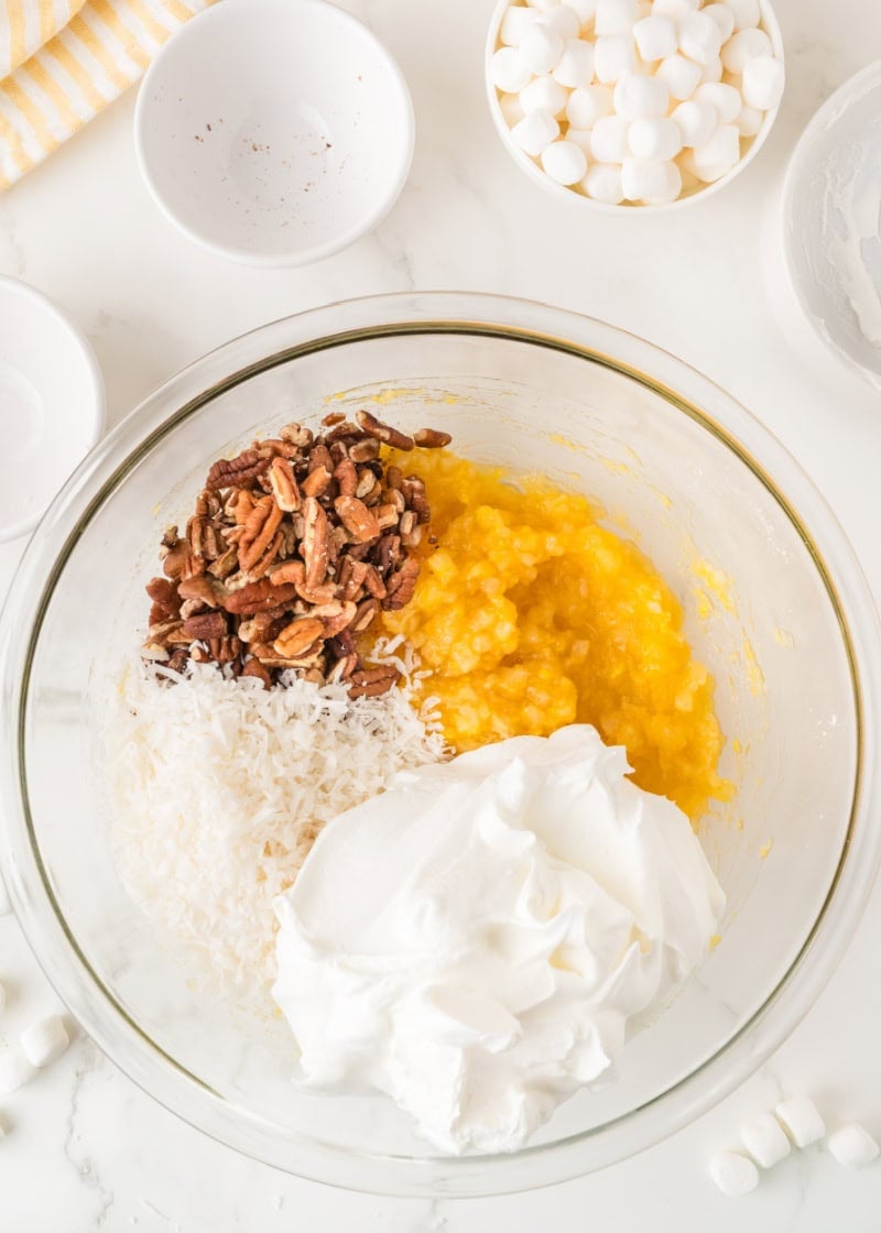 Ingredients for pineapple fluff salad in a bowl.