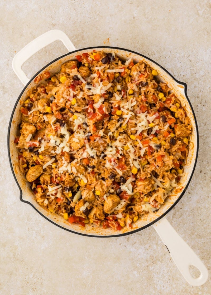 Southwest Chicken Skillet in a pan with melted cheese on top.